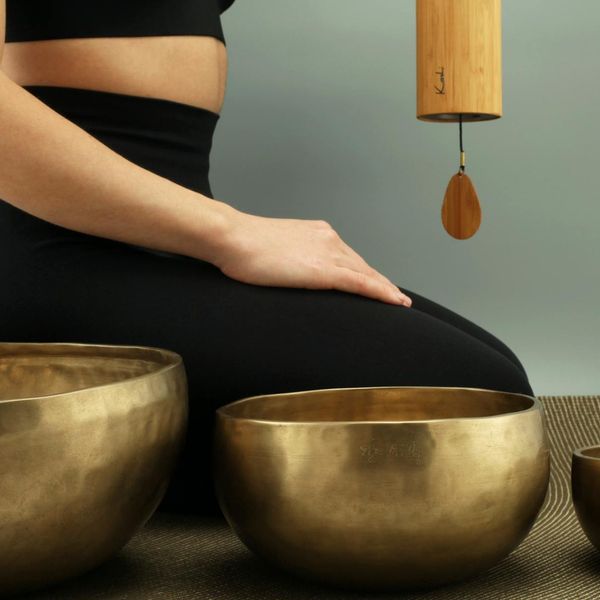 Person in a meditative pose with a serene expression, symbolizing mental clarity and well-being.